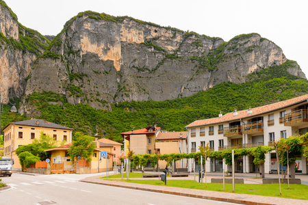 MEZZOCORONA, ITALY - MAY 2, 2016: Houses in front of the mountain in Mezzocorona, Italy.  A comune in Trentino in the northern Italian region Trentino-Alto Adige Sudtirolのeditorial素材