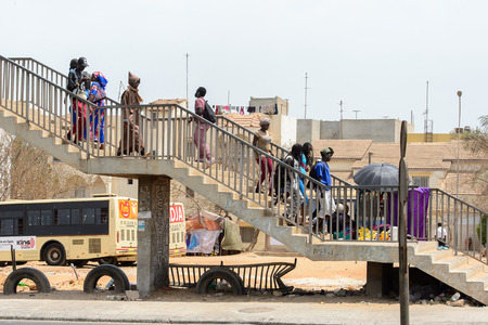 DAKAR, SENEGAL - APR 27, 2017: Unidentified Senegalese people walk on stairs in Dakar, the capital of Senegalのeditorial素材