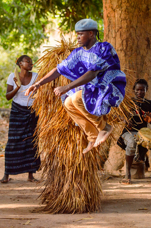 Kaguit vil., SENEGAL - APR 30, 2017: Unidentified Diola man in a dress jumps during a traditional...