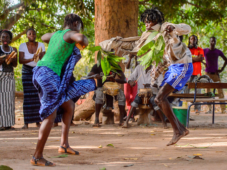 Kaguit vil., SENEGAL - APR 30, 2017: Unidentified Diola man and woman move during a traditional...