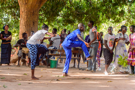 Kaguit vil., SENEGAL - APR 30, 2017: Unidentified Diola man and woman move during a traditional dance Kumpo in a Sacred Forest near Kaguit villageのeditorial素材