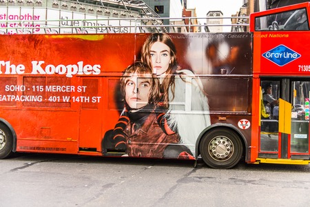 NEW YORK, USA - SEP 22, 2015: Touristic red bus at the Times Square, a major commercial neighborhood in Midtown Manhattan, New York Cityのeditorial素材