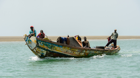 ORANGO ISLAND, GUINEA BISSAU - MAY 3, 2017: Unidentified local people sail in a boat on the Orango Island, Guinea Bissauのeditorial素材