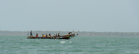 ORANGO ISLAND, GUINEA BISSAU - MAY 3, 2017: Unidentified local people sail in a boat on the Orango Island, Guinea Bissauのeditorial素材