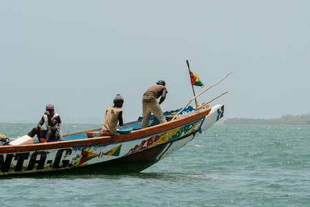 ORANGO ISLAND, GUINEA BISSAU - MAY 3, 2017: Unidentified local people sail in a boat on the Orango Island, Guinea Bissauのeditorial素材
