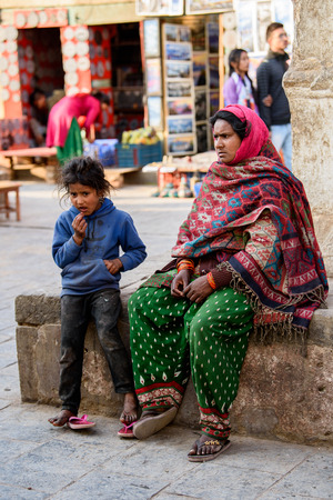 KATMANDU, NEPAL - MAR 6, 2017: Unidentified Chhetri little girl in blue jamper puts her fingers into her mouth. Chhetris is the most populous ethnic group of Nepalのeditorial素材