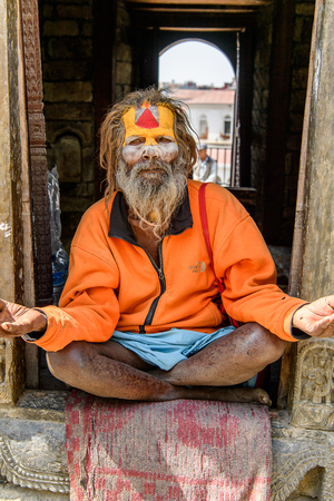 KATMANDU, NEPAL - MAR 6, 2017: Unidentified Chhetri man with beard and painted face looks ahead. Chhetris is the most populous ethnic group of Nepalのeditorial素材