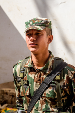 KATMANDU, NEPAL - MAR 6, 2017: Unidentified Chhetri man in military form looks ahead. Chhetris is the most populous ethnic group of Nepalのeditorial素材