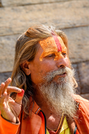 KATMANDU, NEPAL - MAR 6, 2017: Unidentified Chhetri man with beard and painted face looks ahead. Chhetris is the most populous ethnic group of Nepalのeditorial素材