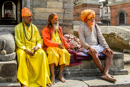 KATMANDU, NEPAL - MAR 6, 2017: Unidentified Chhetri men with beards and painted faces wear orange headscarves. Chhetris is the most populous ethnic group of Nepalのeditorial素材