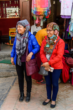 KATMANDU, NEPAL - MAR 6, 2017: Unidentified Chhetri two women in headscarves smile. Chhetris is the most populous ethnic group of Nepalのeditorial素材