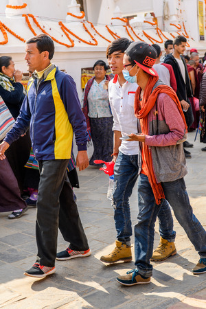 KATMANDU, NEPAL - MAR 6, 2017: Unidentified Chhetri people walk along the street. Chhetris is the most populous ethnic group of Nepalのeditorial素材