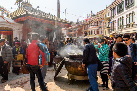 KATMANDU, NEPAL - MAR 6, 2017: Unidentified Chhetri people stand around the cauldron with food. Chhetris is the most populous ethnic group of Nepalのeditorial素材