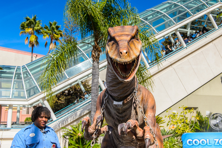 LOS ANGELES, USA - SEP 27, 2015: Realistic velociraptor in Jurassic Park area in the Universal Studios Hollywood Park. Jurassic Park is a 1993  adventure film  by Steven Spielbergのeditorial素材