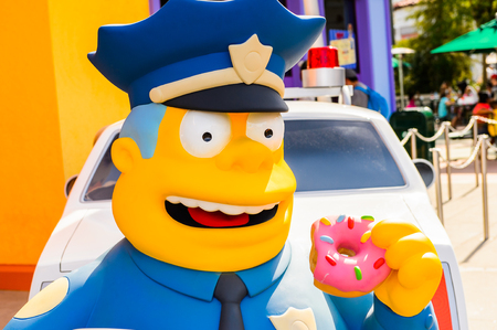 LOS ANGELES, USA - SEP 27, 2015: Police Chief Wiggum at The SImpsons area of the Universal Studios Hollywood Park. The Simpsons is an American animated sitcom by Matt Groeningのeditorial素材