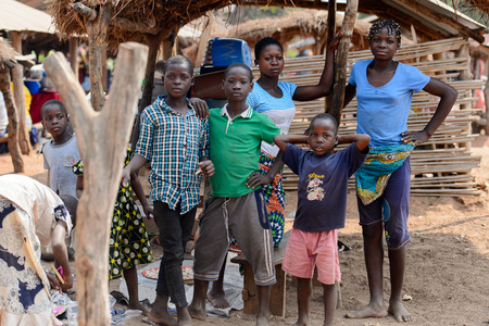 BOHICON, BENIN - JAN 12, 2017: Unidentified Beninese children gather at the local market. Benin children suffer of poverty due to the bad economy.のeditorial素材