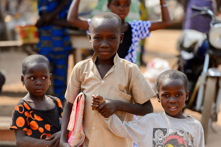 BOHICON, BENIN - JAN 12, 2017: Unidentified Beninese children gather together at the local market. Benin children suffer of poverty due to the bad economy.のeditorial素材