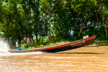 INLE LAKE, MYANMAR - AUG 30, 2016: Unidentified Burmese man in bamboo boat sails over the Inle Sap,a freshwater lake located in the Nyaungshwe Township of Taunggyi District of Shan State, Myanmarのeditorial素材