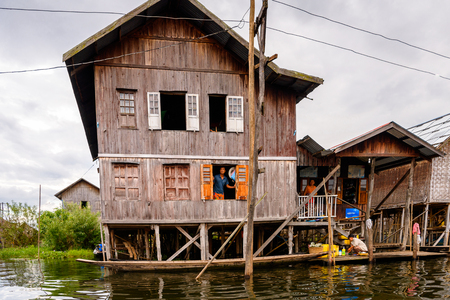 INLE LAKE, MYANMAR - AUG 30, 2016: Wooden architecture of the Inpawkhon village over the Inle Sap,a freshwater lake in the Nyaungshwe Township of Taunggyi District of Shan State, Myanmarのeditorial素材