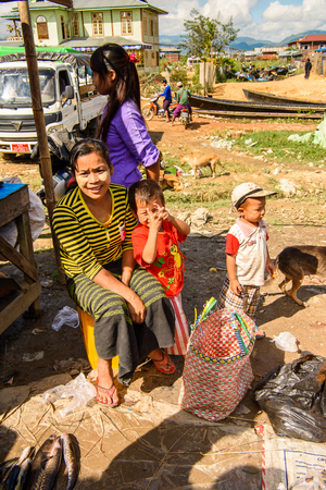 INLE LAKE, MYANMAR - AUG 30, 2016: Unidentified Burmese woman works at the market place, the Inle Sap,a freshwater lake  in the Nyaungshwe Township of Taunggyi District of Shan State, Myanmarのeditorial素材