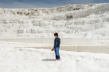 PAMUKKALE, TURKEY - APR 18, 2015: Unidentified little boy on the travertines of Pamukkale, Turkey. It's a UNESCO World Heritage siteのeditorial素材