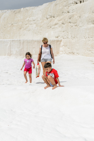 PAMUKKALE, TURKEY - APR 18, 2015: Unidentified tourists walk on the travertines of Pamukkale, Turkey. It's a UNESCO World Heritage siteのeditorial素材