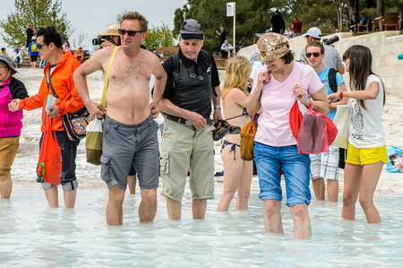 PAMUKKALE, TURKEY - APR 18, 2015: Unidentified tourists have fun on the travertines of Pamukkale, Turkey. It's a UNESCO World Heritage siteのeditorial素材