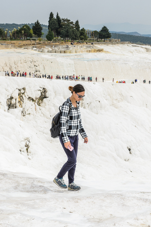 PAMUKKALE, TURKEY - APR 18, 2015: Unidentified beautiful girl on the travertines of Pamukkale, Turkey. It's a UNESCO World Heritage siteのeditorial素材