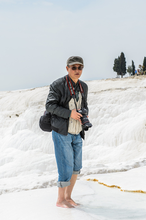 PAMUKKALE, TURKEY - APR 18, 2015: Unidentified tourist on the travertines of Pamukkale, Turkey. It's a UNESCO World Heritage siteのeditorial素材