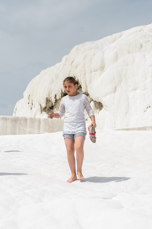 PAMUKKALE, TURKEY - APR 18, 2015: Unidentified tourist on the travertines of Pamukkale, Turkey. It's a UNESCO World Heritage siteのeditorial素材