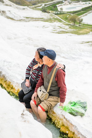 PAMUKKALE, TURKEY - APR 18, 2015: Unidentified Asian couple on the travertines of Pamukkale, Turkey. It's a UNESCO World Heritage siteのeditorial素材