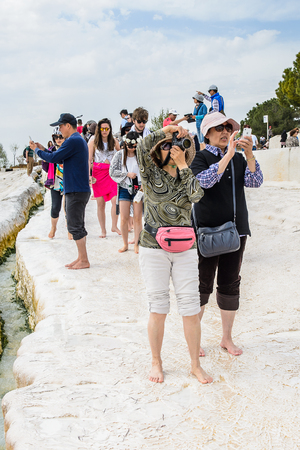 PAMUKKALE, TURKEY - APR 18, 2015: Unidentified tourists on the travertines of Pamukkale, Turkey. It's a UNESCO World Heritage siteのeditorial素材