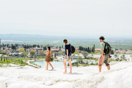 PAMUKKALE, TURKEY - APR 18, 2015: Unidentified tourists walk on the travertines of Pamukkale, Turkey. It's a UNESCO World Heritage siteのeditorial素材