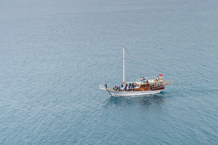 ANTALYA, TURKEY - APR 19, 2015: Touristic yacht on the Mediterranean sea near the Old harbour in Antalya (Kaleici), Turkey.  Mediterranean sea is 2,500,000 km2のeditorial素材