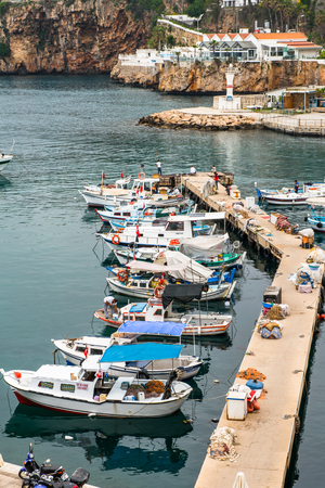 ANTALYA, TURKEY - APR 19, 2015: Ships in the old harbour in Antalya (Kaleici), Turkey. Old town of Antalya is a popular destination among  touristsのeditorial素材
