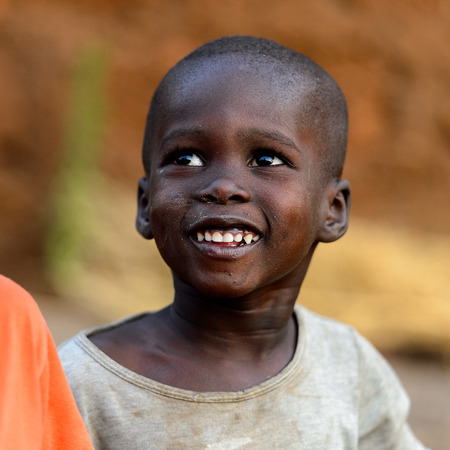 MASSIF KABYE, TOGO - JAN 13, 2017: Unidentified Togolese little boy smiles in the village. Togo children suffer of poverty due to the bad economy.のeditorial素材
