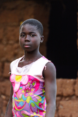 MASSIF KABYE, TOGO - JAN 13, 2017: Unidentified Togolese  woman looks ahead in the village. Togo people suffer of poverty due to the bad economy.のeditorial素材