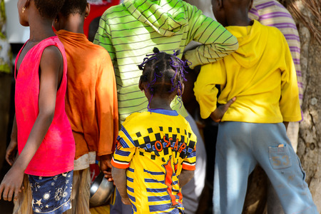 KARA REG., TOGO - JAN 14, 2017: Unidentified Konkomba little girl from behind in the village. Konkombas are ethnic group of Togoのeditorial素材