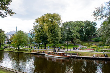 RIGA, LATVIA - SEP 7, 2014: Touristic boat in the Kronvalda park in Riga, Latvia. Park is named after the Latvian linguist Atis Kronvaldのeditorial素材