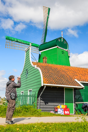 ZAANSE SCHANS, NETHERLANDS - MAY 2, 2015: Nature and windmills in Zaanse Schans, Northe Holland, Netherlands. This village is a popular touristic destination in Netherlandsのeditorial素材