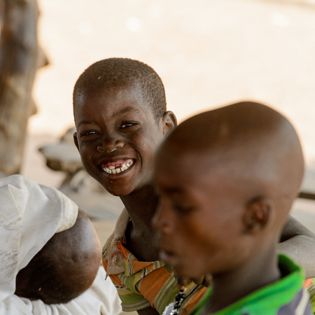 GHANI, GHANA - JAN 14, 2017: Unidentified Ghanaian boy smiles in the Ghani village. Ghana children suffer of poverty due to the bad economy.のeditorial素材