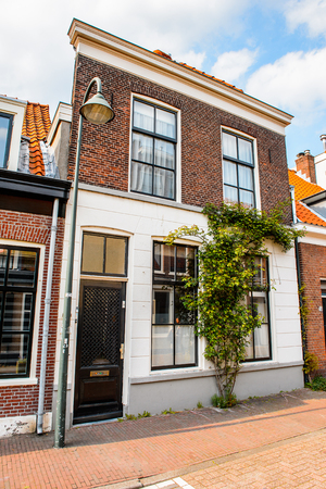DELFT, NETHERLANDS - MAY 2, 2015: Beautiful architecture of Delft, Netherlands. Delft is a popular touristic destination due to the town centre with canalsのeditorial素材
