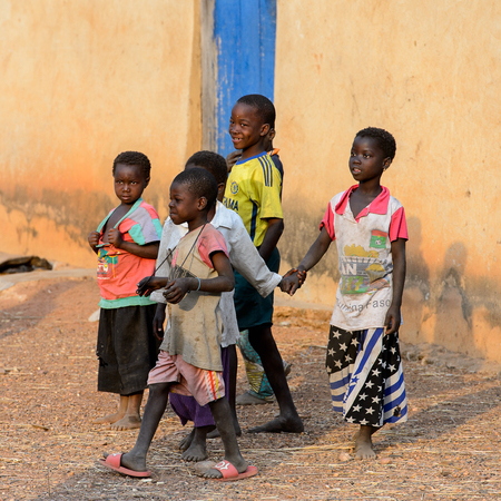 DAGOMBA VILLAGE, GHANA - JAN 14, 2017: Unidentified Dagomban children walk in the local village. Dagombas are ethnic group of Northern Ghanaのeditorial素材