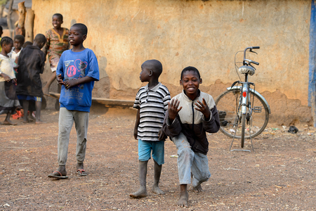 DAGOMBA VILLAGE, GHANA - JAN 14, 2017: Unidentified Dagomban boys walk in the local village. Dagombas are ethnic group of Northern Ghanaのeditorial素材