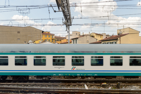 FLORENCE, ITALY - MAY 6, 2016: Trenitalia company train in movement near Florence. Trenitalia is the primary train operator in Italyのeditorial素材