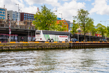 AMSTERDAM, NETHERLANDS - JUN 1, 2015: Floating boats on the Canal of Amsterdam. Amsterdam is the capital city and most populous city of the Kingdom of the Netherlandsのeditorial素材