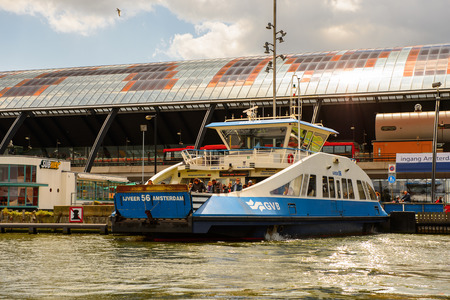 AMSTERDAM, NETHERLANDS - JUN 1, 2015: Central railway station of Amsterdam. Amsterdam is the capital city and most populous city of the Kingdom of the Netherlandsのeditorial素材