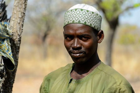 BRONG AHAFO, GHANA - JAN 15, 2017: Unidentified Fulani man in national clothes looks ahead in the local village. Fulanis are ethnic group of Ghanaのeditorial素材