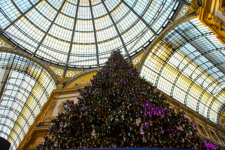 MILAN, ITALY - DEC 23, 2014: Christmas tree in the Galleria Vittorio Emanuele II, one of the world's oldest shopping malls. The gallery is built between 1865 and 1877 by Giuseppe Mengoniのeditorial素材