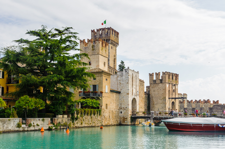 SIRMIONE, ITALY - JUNE 26, 2014: Castello Scaligero di Sirmione (Sirmione Castle), built in XIV century, Lake Garda, Sirmione, Italyのeditorial素材